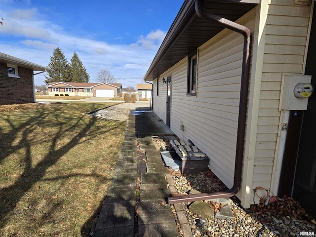 view of property exterior featuring a lawn