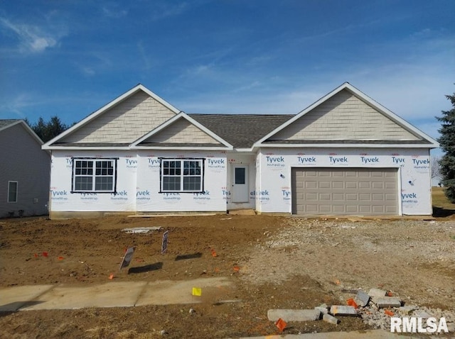 view of front of property with a garage