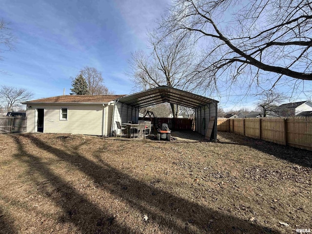 exterior space featuring a yard and a carport