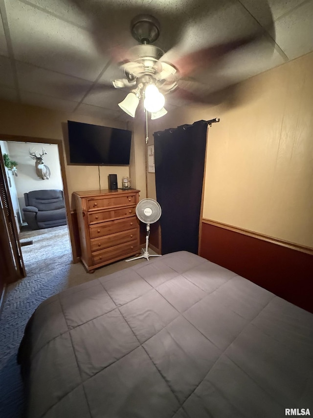 bedroom with light carpet and ceiling fan