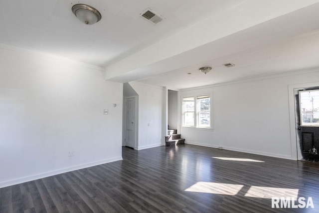 unfurnished living room with crown molding and dark hardwood / wood-style floors