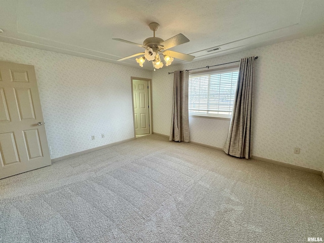 unfurnished room with carpet flooring and ceiling fan