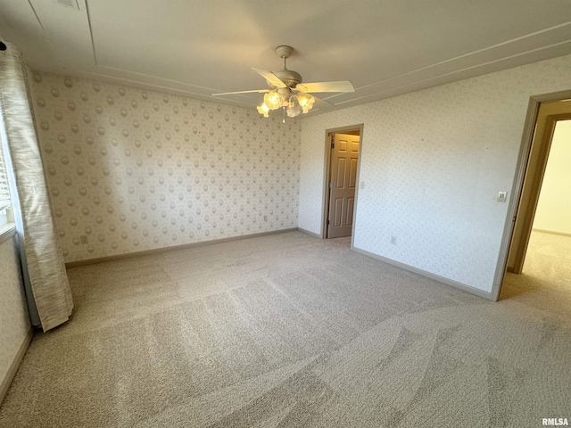 unfurnished bedroom with ceiling fan and carpet