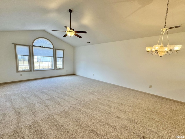 carpeted spare room with lofted ceiling and ceiling fan with notable chandelier