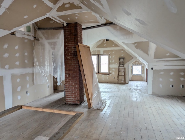 bonus room with light wood-type flooring