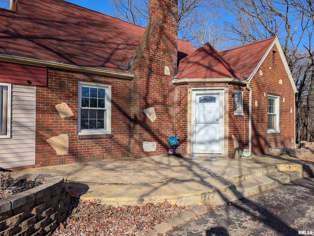 property entrance with a patio