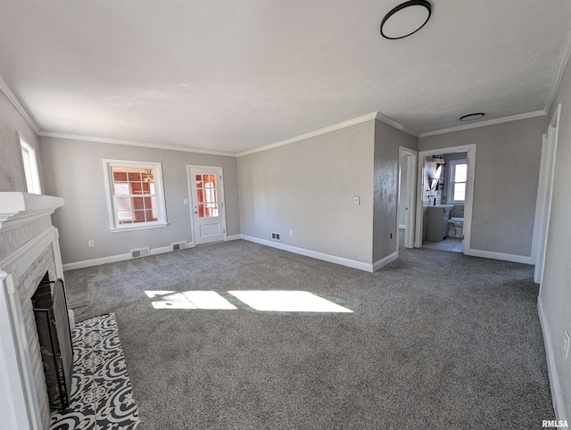 unfurnished living room with crown molding and carpet