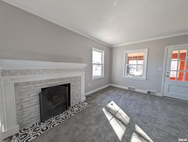 unfurnished living room with ornamental molding, carpet, and a fireplace