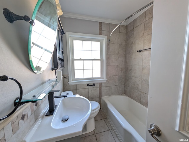 full bathroom with sink, tile walls, ornamental molding, toilet, and tile patterned floors