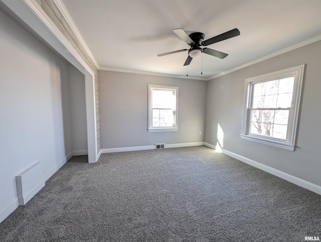 unfurnished bedroom with crown molding, ceiling fan, and carpet