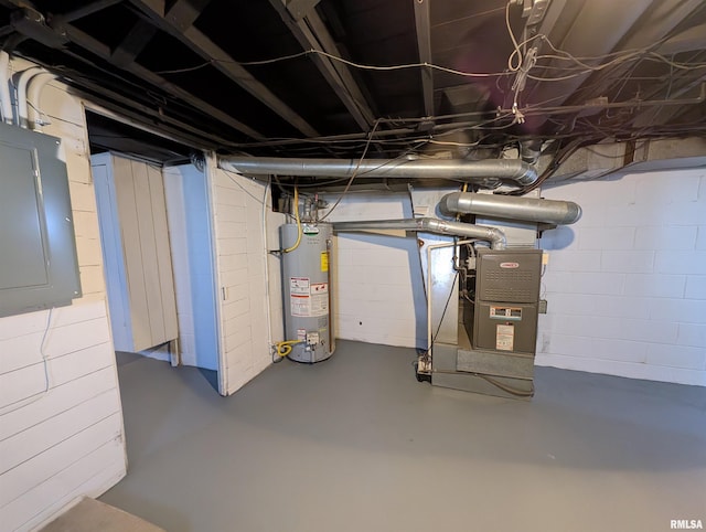 basement with electric panel, heating unit, and gas water heater