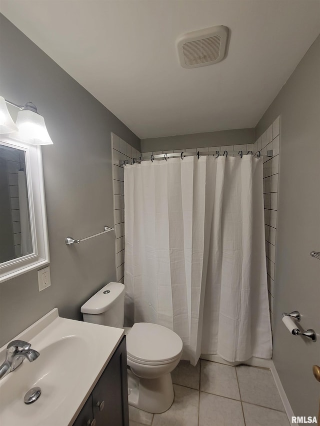 bathroom featuring a shower with shower curtain, vanity, toilet, and tile patterned flooring