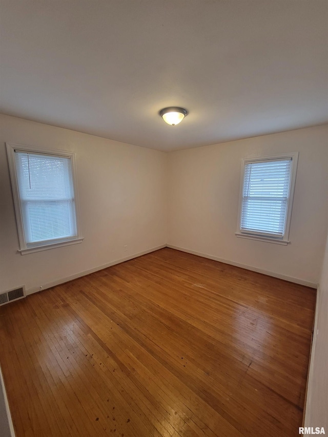 empty room featuring wood-type flooring