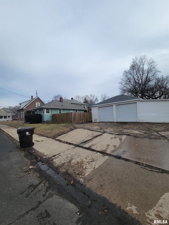 view of front facade with a garage and an outdoor structure