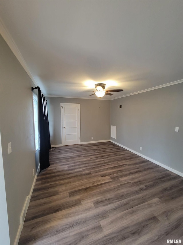 unfurnished room with ornamental molding, dark hardwood / wood-style floors, and ceiling fan