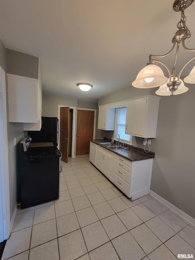 kitchen with sink, black refrigerator, electric range, white cabinets, and light tile patterned flooring