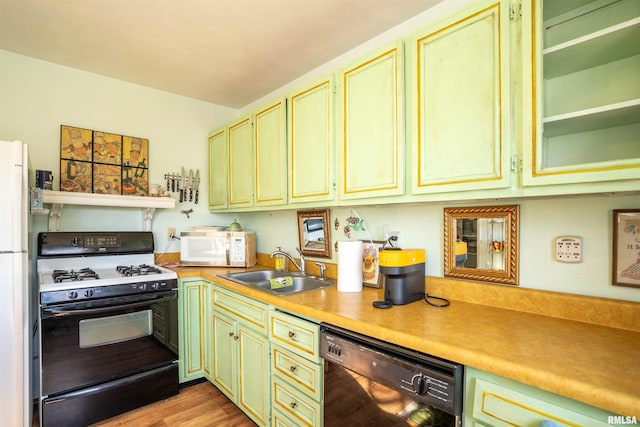 kitchen featuring white appliances, sink, and light wood-type flooring