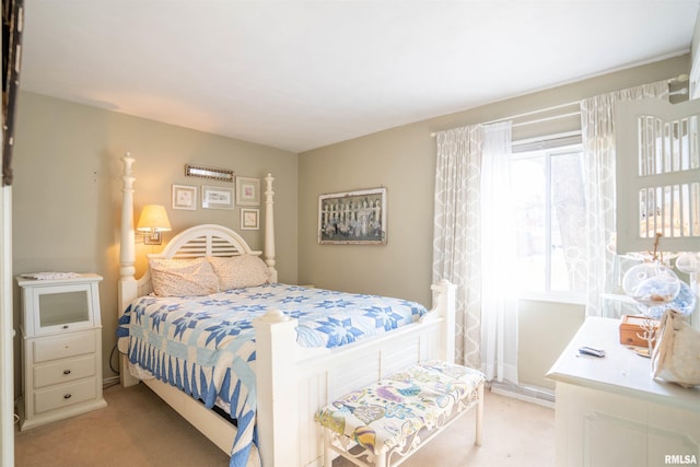 bedroom featuring light colored carpet