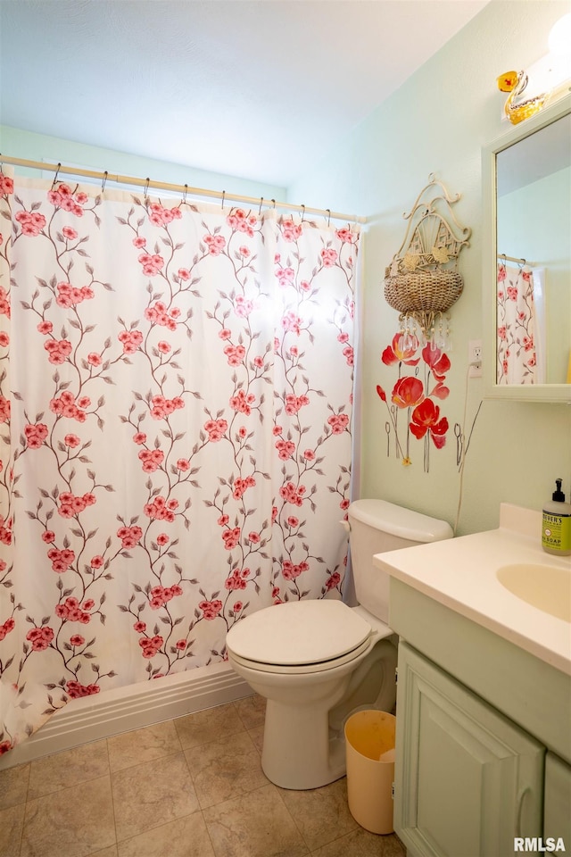 full bathroom with tile patterned flooring, vanity, shower / tub combo, and toilet