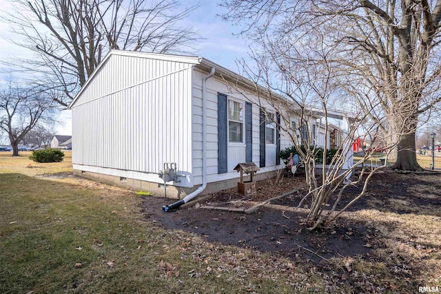 view of property exterior featuring a lawn