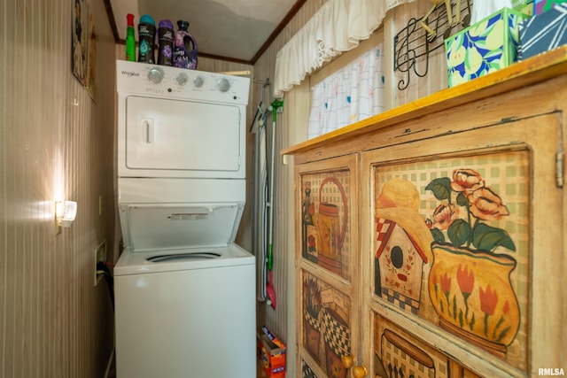 washroom with stacked washer and clothes dryer