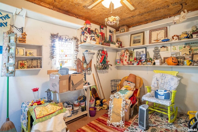 interior space with wood ceiling and ceiling fan