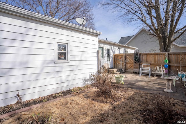 view of side of home featuring a patio