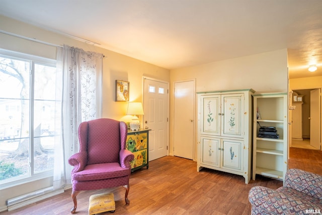 living area with hardwood / wood-style flooring