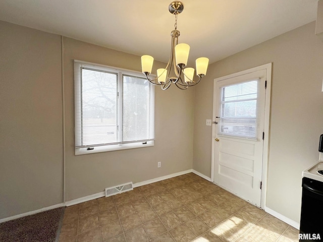 unfurnished dining area with a notable chandelier