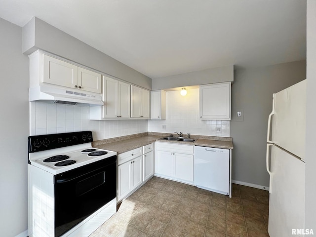 kitchen with sink, white cabinets, white appliances, and decorative backsplash