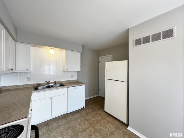 kitchen featuring tasteful backsplash, sink, white appliances, and white cabinets