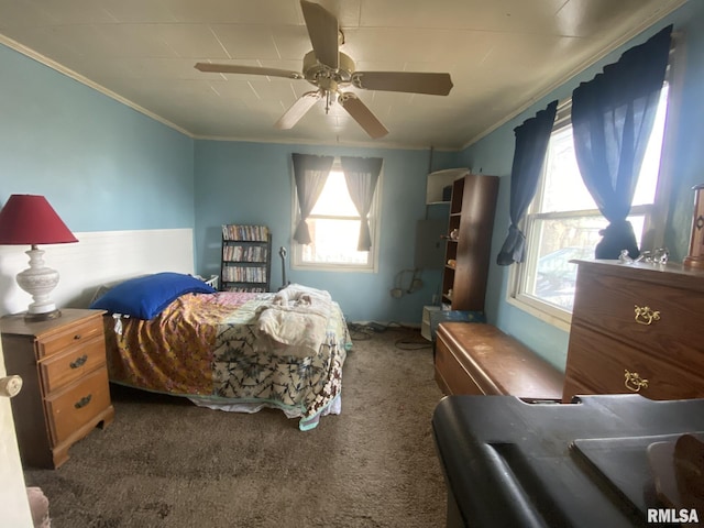 carpeted bedroom featuring ornamental molding and ceiling fan