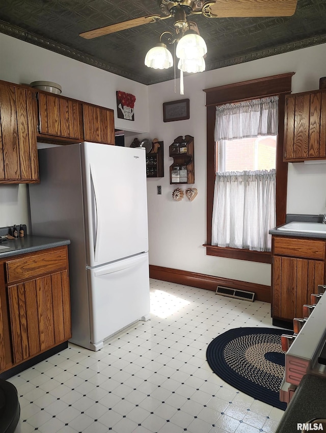 kitchen with white refrigerator and sink