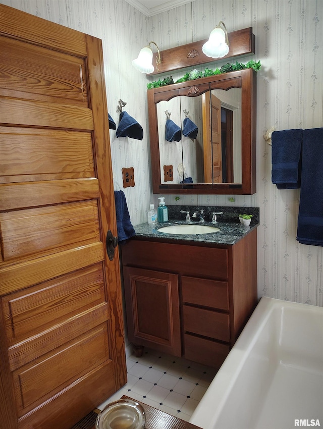 bathroom with vanity, tile patterned flooring, and a washtub