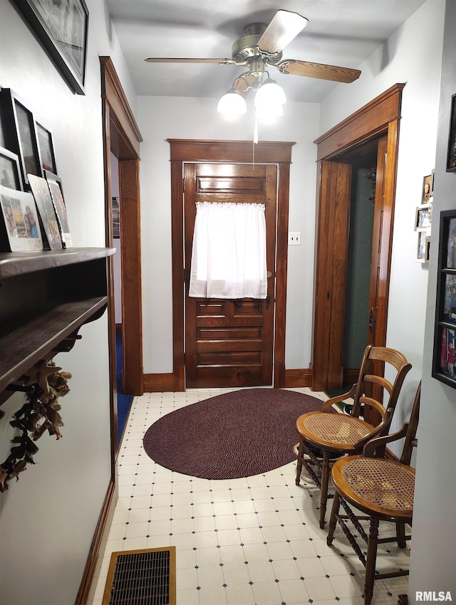 entrance foyer with ceiling fan