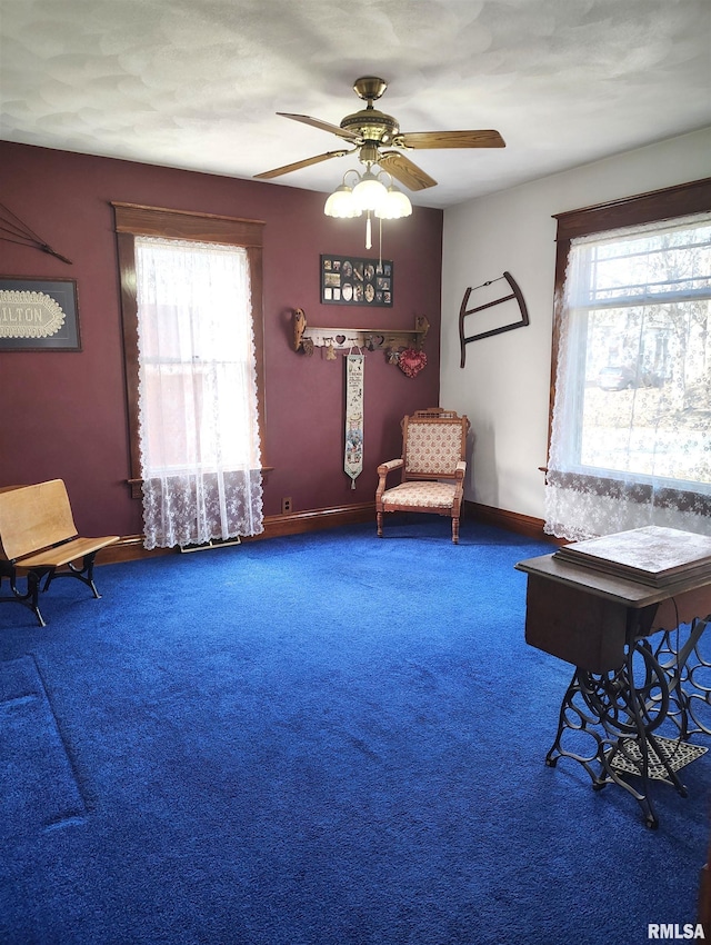 unfurnished room with plenty of natural light, carpet, and ceiling fan