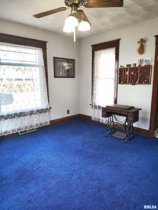 interior space featuring ceiling fan