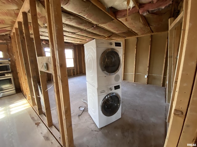 laundry area with stacked washing maching and dryer