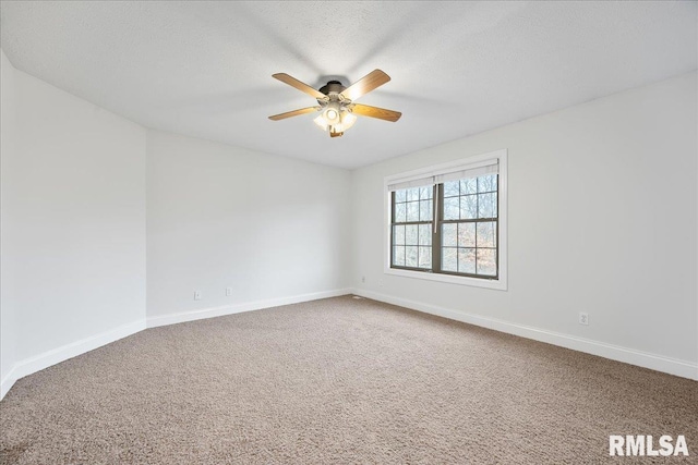 unfurnished room featuring ceiling fan, carpet floors, and a textured ceiling