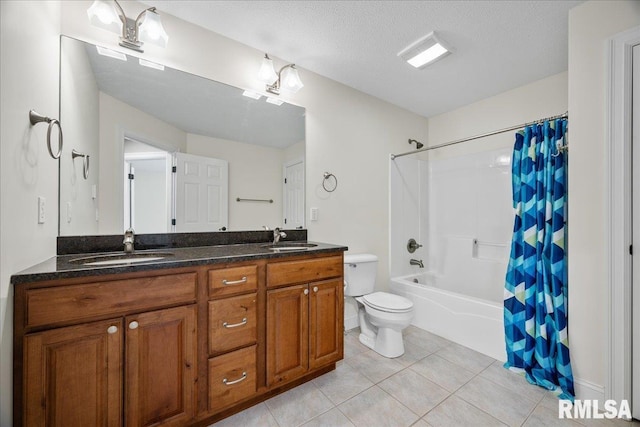 full bathroom with shower / tub combo with curtain, tile patterned floors, toilet, a textured ceiling, and vanity