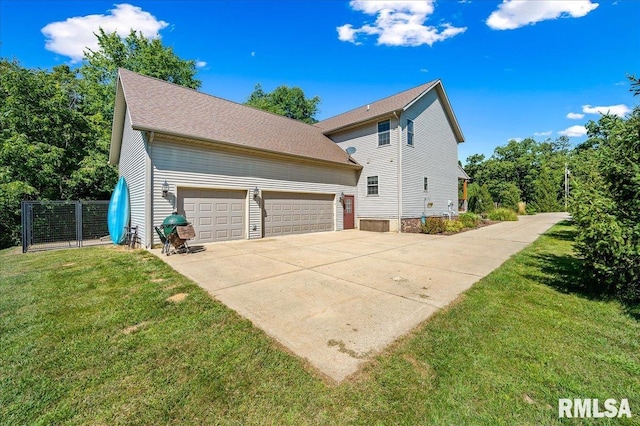 view of side of property with a lawn