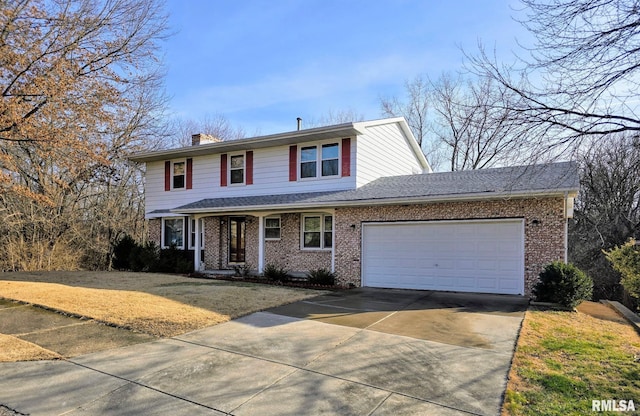 view of front property with a garage and a front lawn