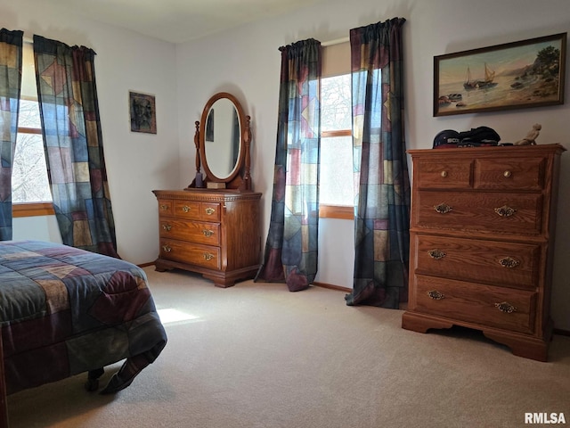 bedroom featuring light carpet