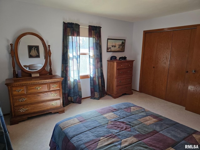 carpeted bedroom with a closet