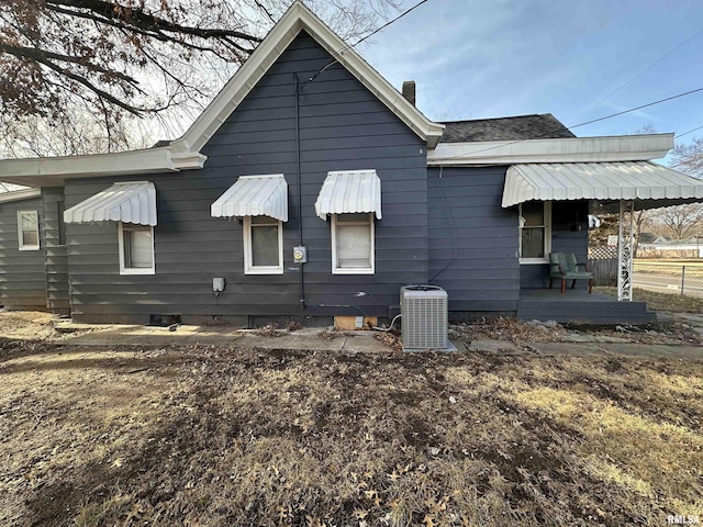 back of property featuring central AC