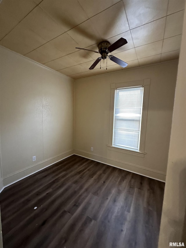 unfurnished room featuring ceiling fan and dark hardwood / wood-style floors