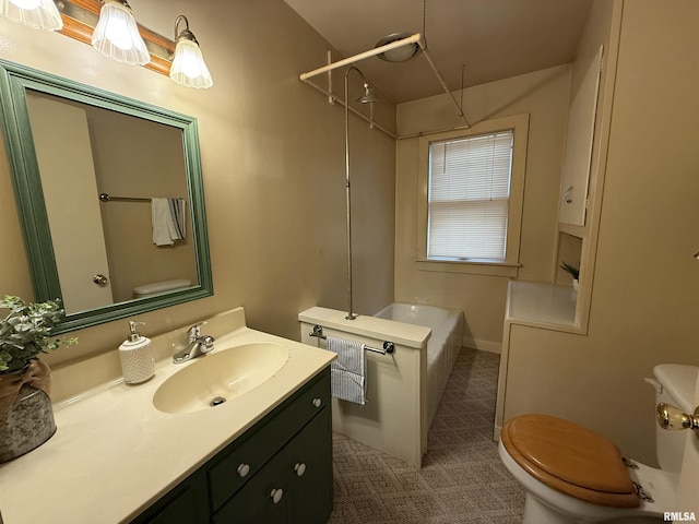 bathroom with vanity, tile patterned floors, a bathtub, and toilet