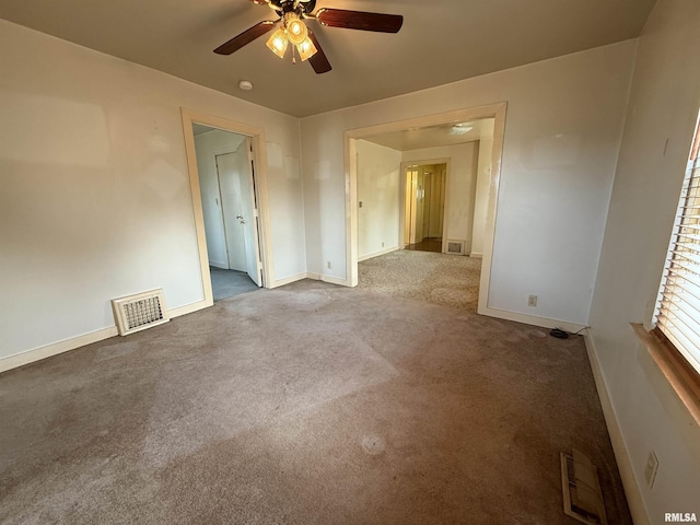 empty room with light carpet and ceiling fan