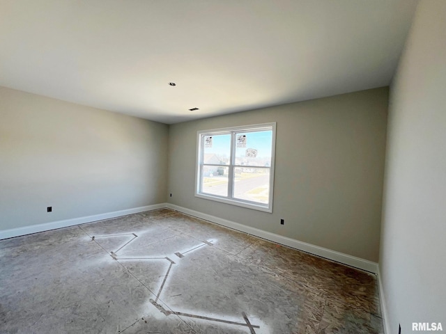 empty room with baseboards