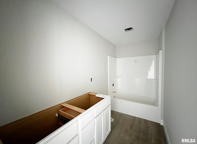 full bathroom with shower / bath combination and wood finished floors